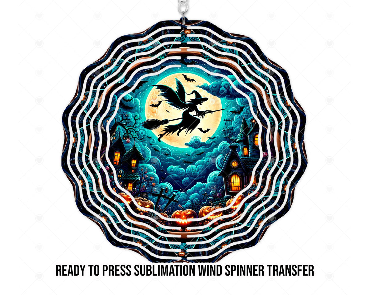 Mockup of Halloween artwork for a physical printed sublimation transfer, shown on a scalloped wind spinner shape. A black witch silhouette rides a broom across a yellow full moon, surrounded by bats, swirling teal clouds, crooked haunted houses with orange-lit windows, and jack-o’-lanterns. The product is the transfer, not a finished spinner or digital file.